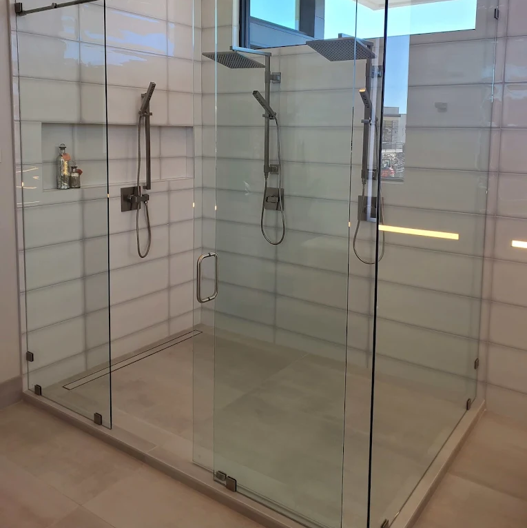 Glass shower installed in bathroom with new waterproof flooring