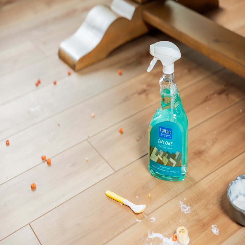 Barrett Floors Vinyl Flooring, Prescott AZ: A cat in a sweater sleeping on vinyl flooring