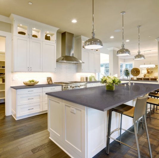 Bright open concept kitchen with Slate Grey countertops by Arizona Tile