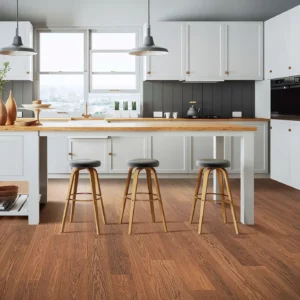 Mohawk Laminate in a rich reddish-brown wood color in a kitchen | Barrett Floors