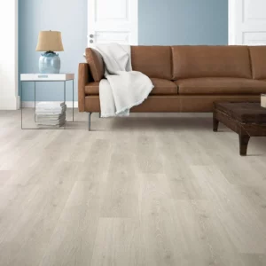 Mohawk Laminate in a light, almost white wood tone in a living room | Barrett Floors