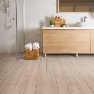 Shaw Floors tile with a light wood look, in a modern bathroom | Barrett Floors